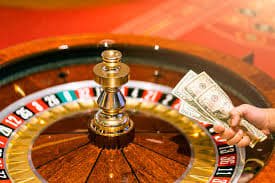hawkbet live dealer conducting Number Table draw on camera